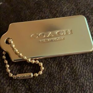 Coach gold tag